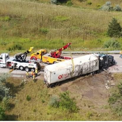 Mike's rotator recovering an overturned trailer in a field