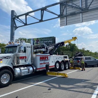 Mike's heavy-duty wrecker under the Saginaw exit sign