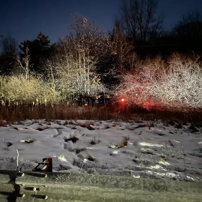 Off-road recovery site in the brush at night