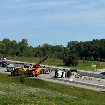 Mike's rotator recovering a rolled semi beside the highway