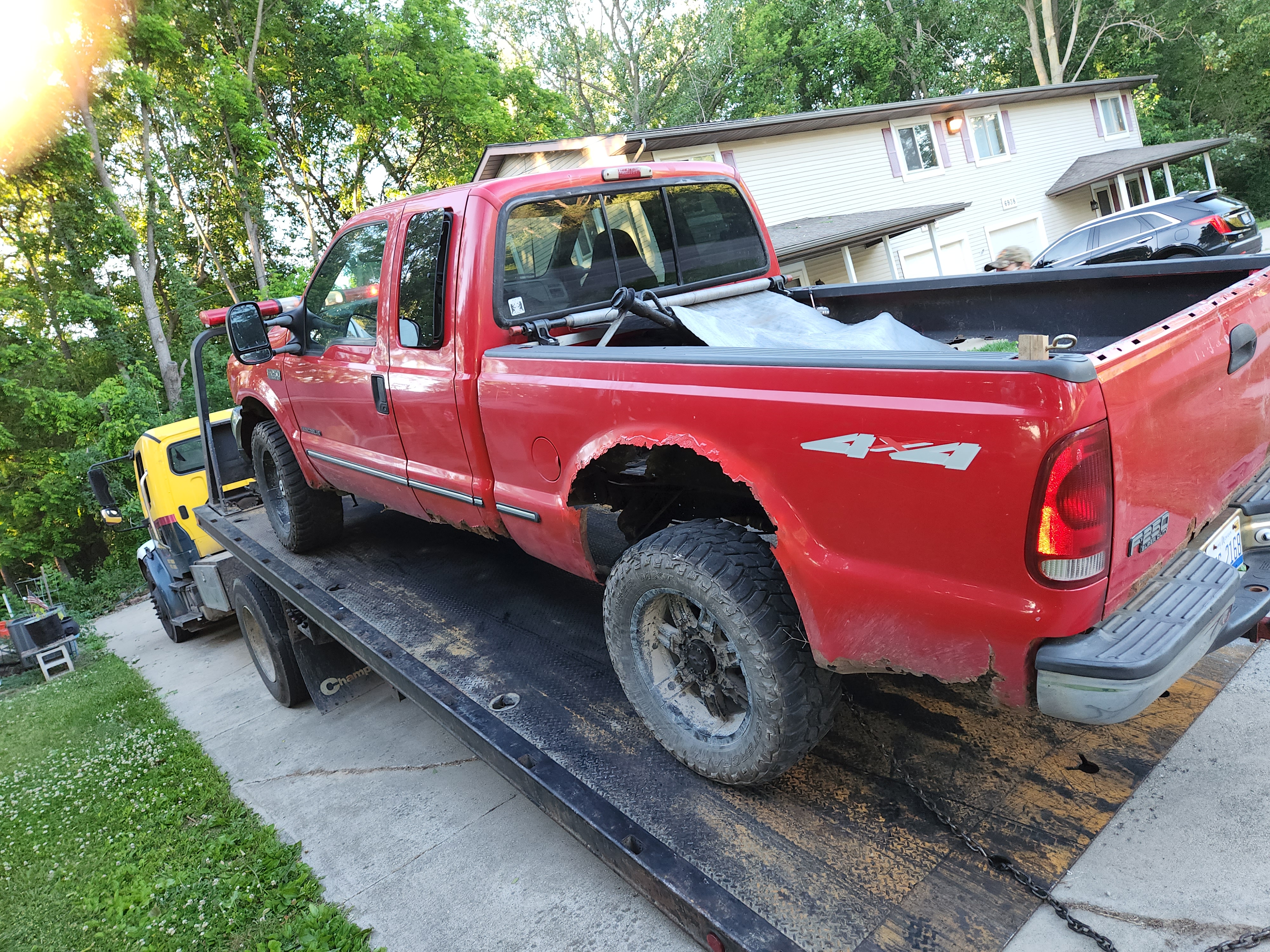 Pickup loaded on Mike's flatbed at a customer's home