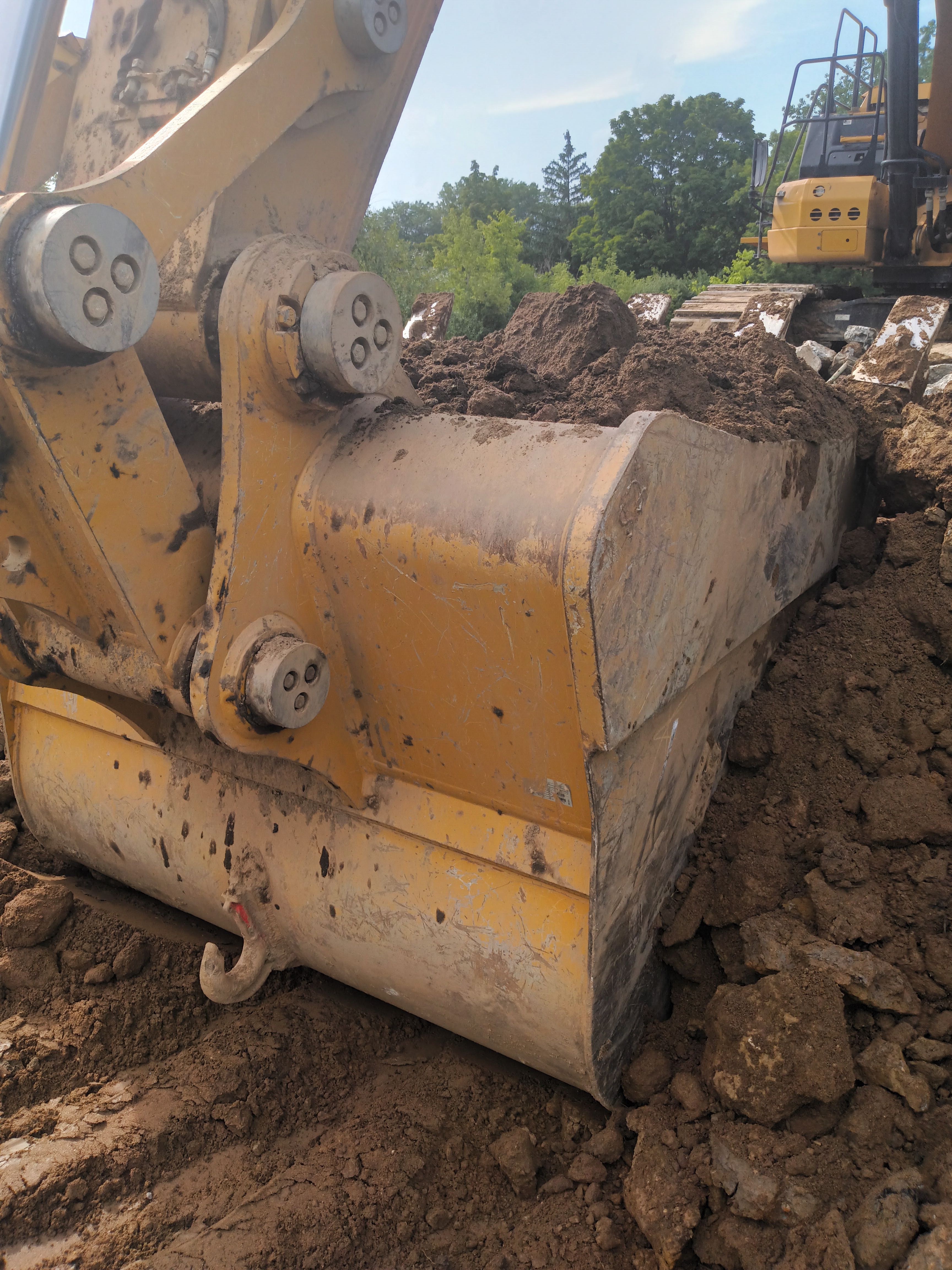 Excavator bucket close-up at a job site