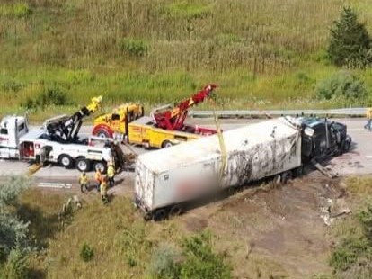 Mike's Wrecker crews recovering an overturned semi trailer